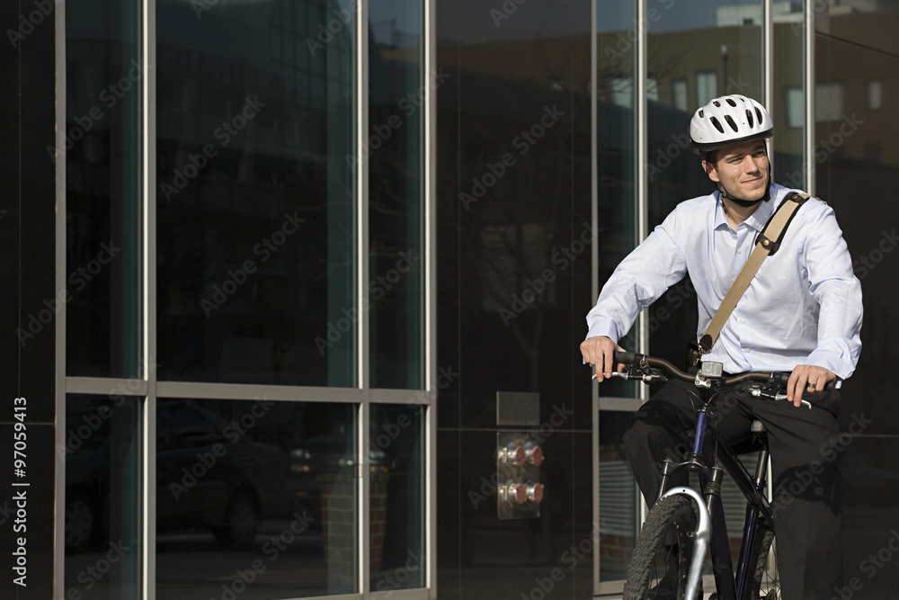 Office worker riding bicycle Office worker riding bicycle