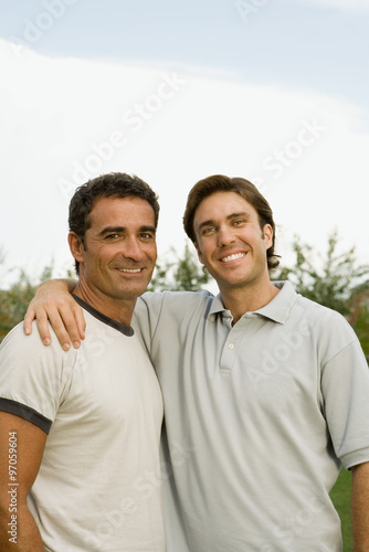 Two smiling men outdoors