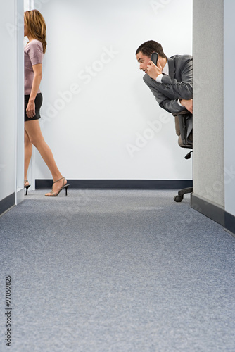 Businessman staring at woman