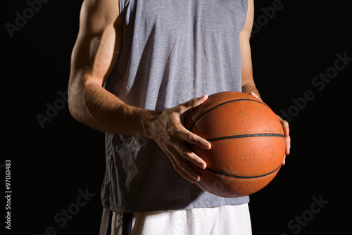 Man holding a basketball © xixinxing