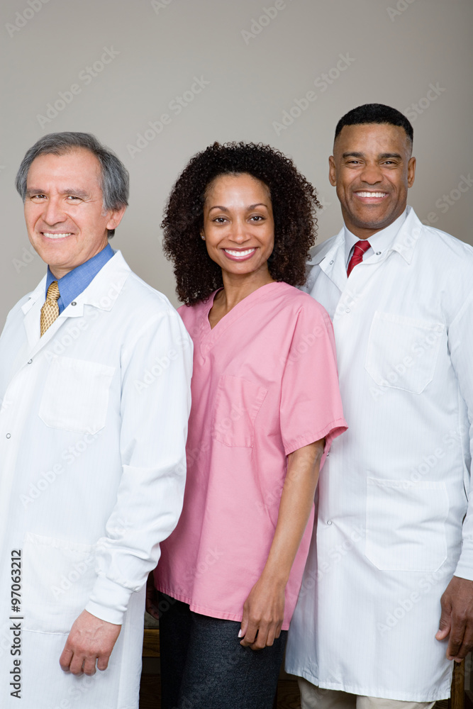 Two dentists and a dental nurse Two dentists and a dental nurse