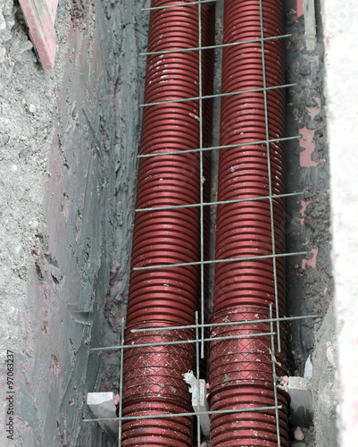 thick polyethylene pipes in the excavation of the road construct photo