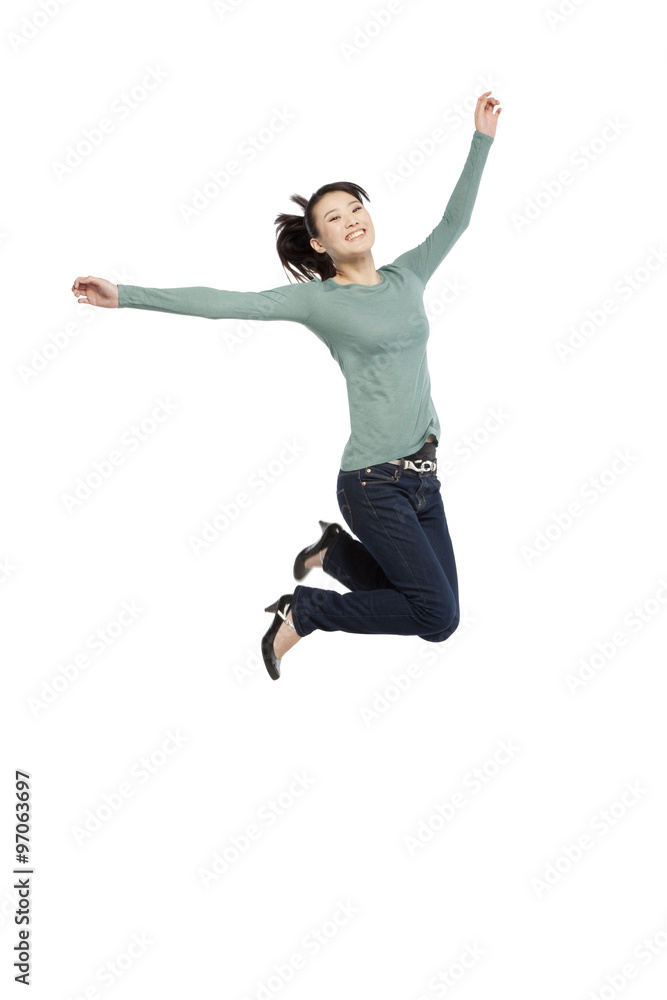 Portrait of an excited young woman mid-air