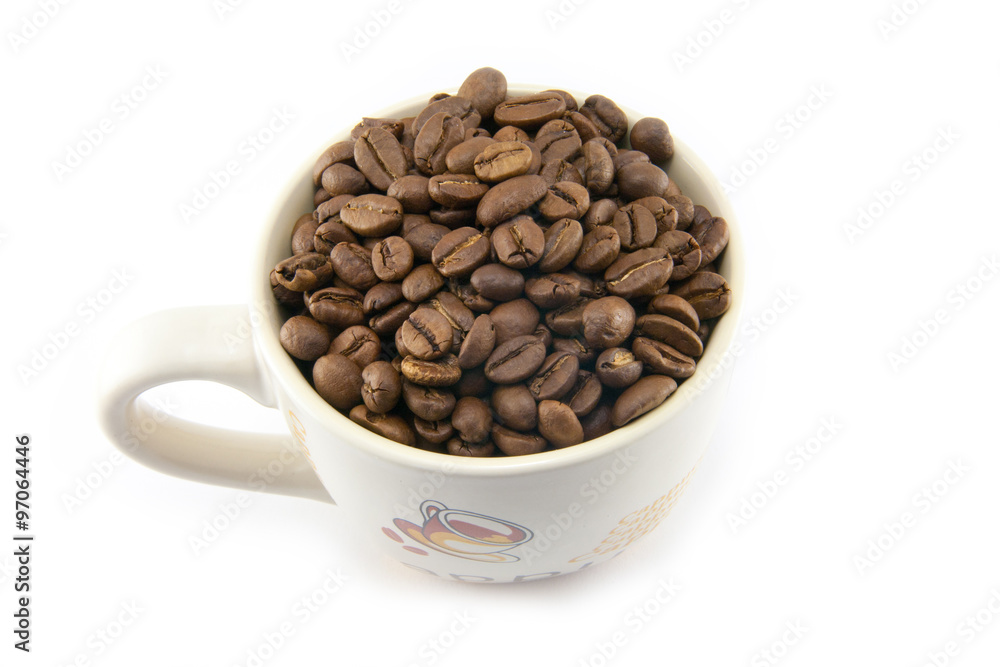 Cup full of coffee beans isolated Cup full of coffee beans isolated