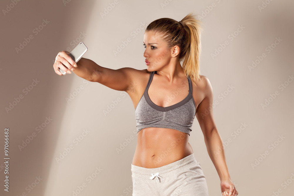 athletic young woman doing selfies athletic young woman doing selfies