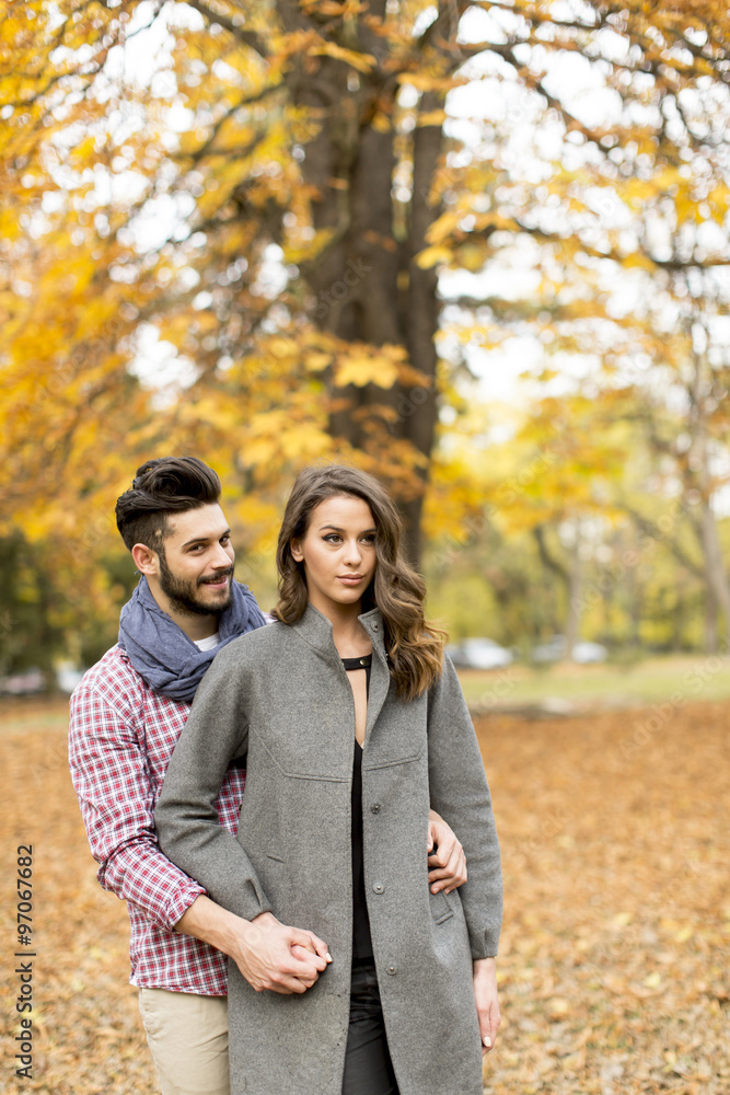 Young couple in the autumn park Young couple in the autumn park