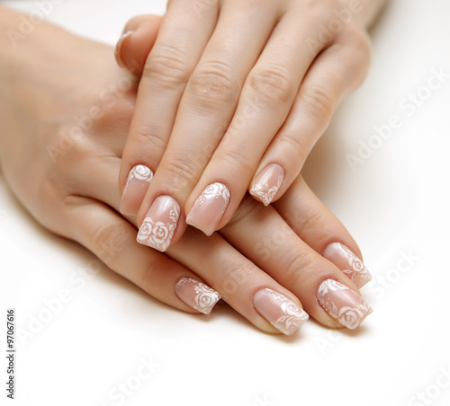 Young woman hands with natural "french" manicure