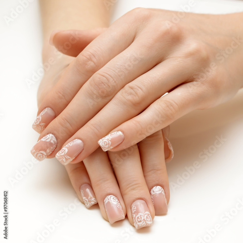 woman hands with natural "french" manicure