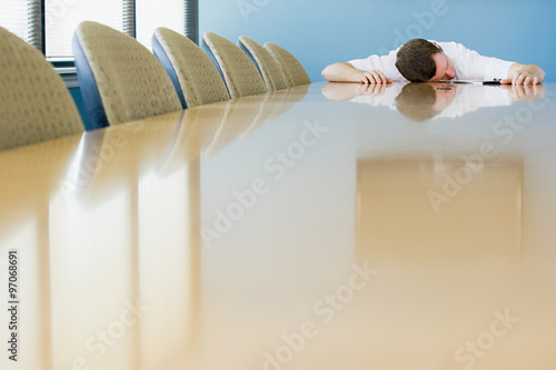 Canvas Print Man sleeping on conference table