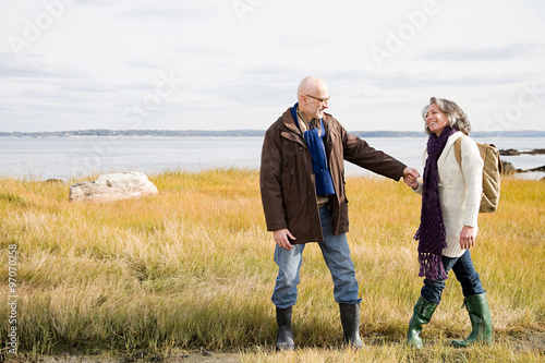 Mature couple walking on marshland