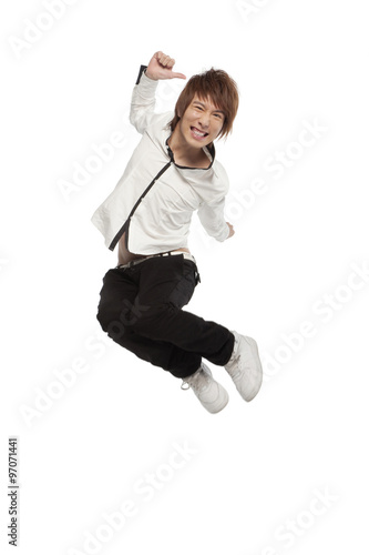 Portrait of an excited young man mid-air