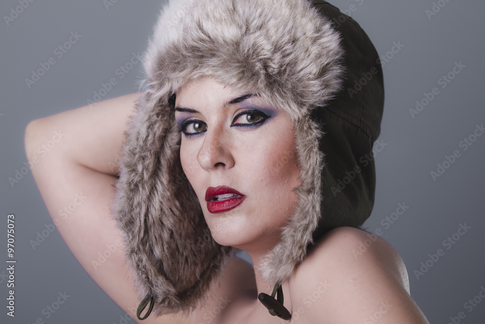 Luxury beautiful nude woman with furry winter hat girl cold Stock Photo