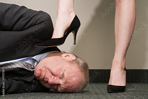 Fototapeta Woman dominating businessman