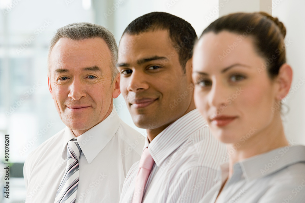 Three business colleagues in a row Three business colleagues in a row