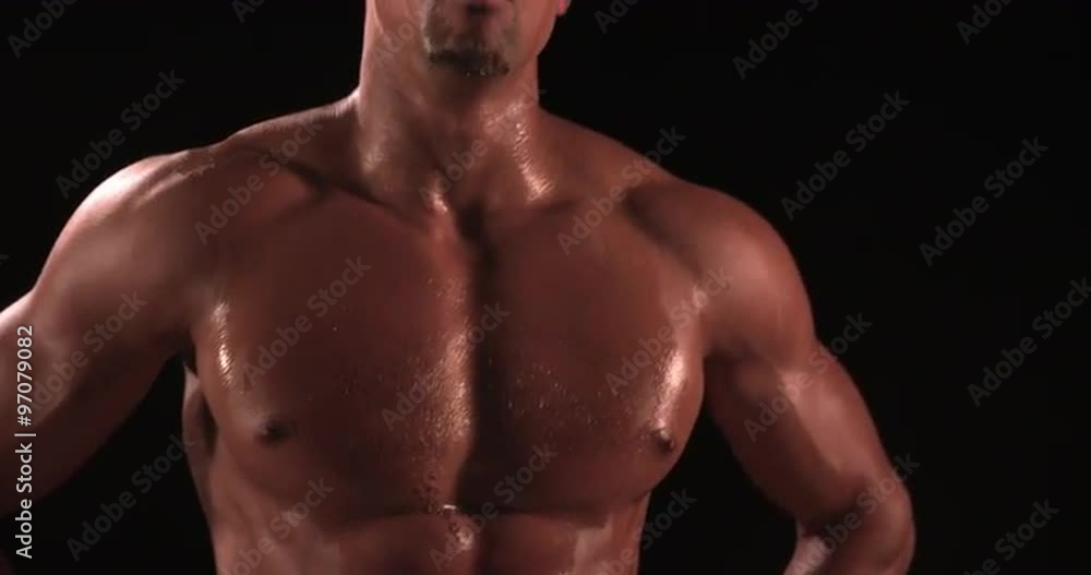Bare chested male body builder with hands on hips Bare chested male body builder with hands on hips
