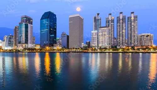 Night scene of modern city with river in bangkok, Thailand