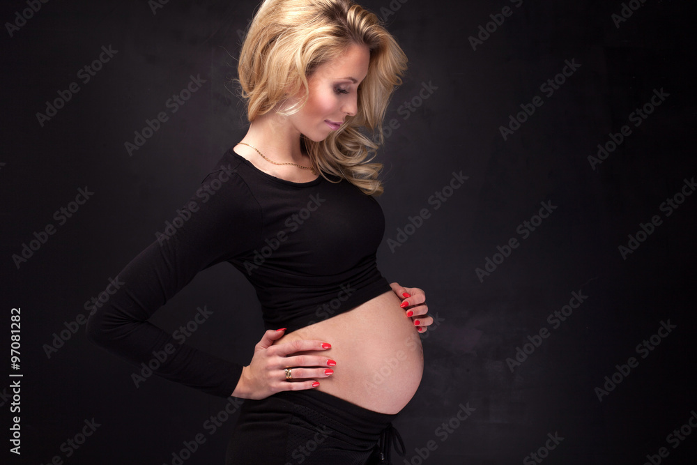 Pregnant woman in studio. Pregnant woman in studio.