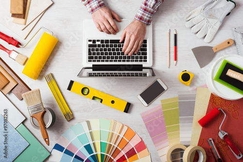 Professional decorator working at desk
