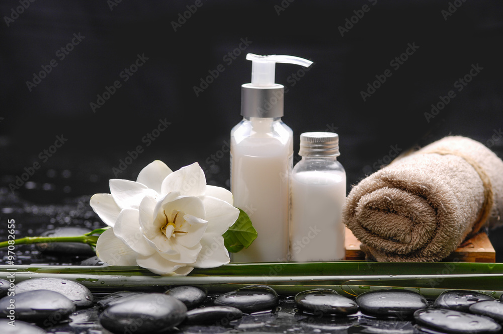 spa still life – massage oil and, gardenia ,leaf , towel spa still life – massage oil and, gardenia ,leaf , towel