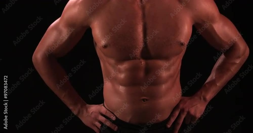 Bare chested male body builder with hands on hips, crop Bare chested male body builder with hands on hips, crop
