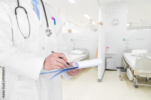 Doctor writing a medical prescription with medical background