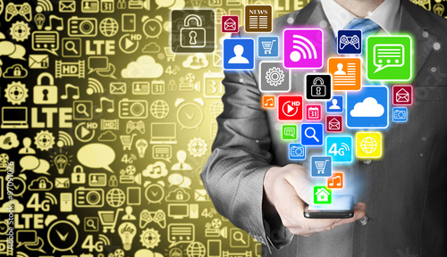 Business man using smart phone with social media icon set