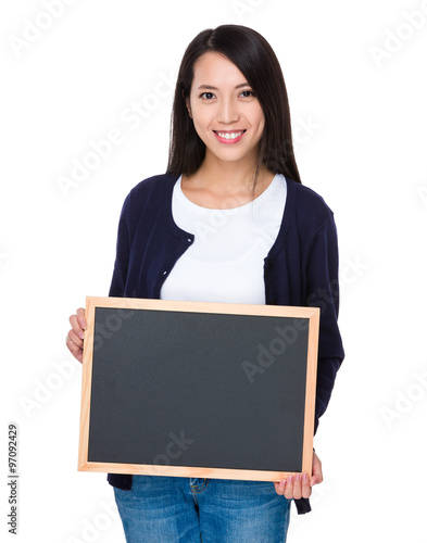 Asian young woman showing blank chalkboard