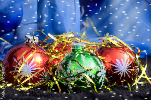 Colored Christmas balls on a blue backdrop
