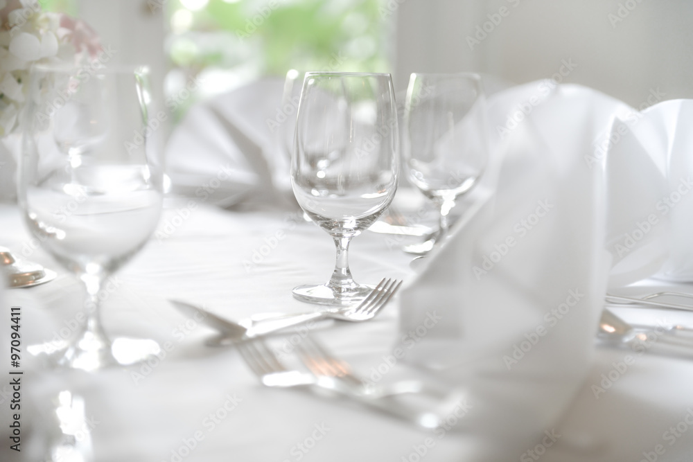 Glasses, Wine Glasses and plates on table in restaurant Glasses, Wine Glasses and plates on table in restaurant