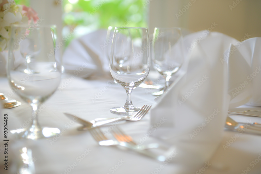 Glasses, Wine Glasses and plates on table in restaurant Glasses, Wine Glasses and plates on table in restaurant