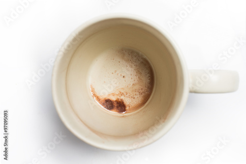 Used coffee cup isolated on white background photo