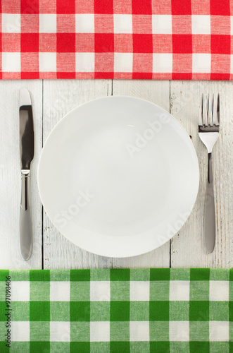 cloth napkin and plate on wood