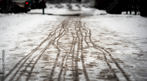 Photography footprints on the snowy sidewalk