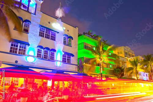 Miami Beach, Florida Moving traffic hotels and restaurants at sunset on Ocean Drive, world famous destination for it's nightlife, beautiful summer  weather and pristine beaches