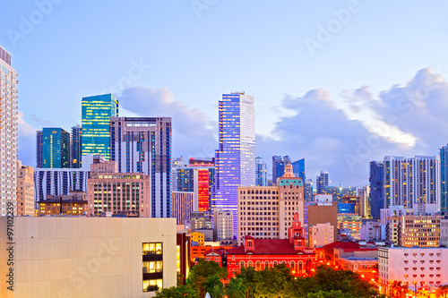 SUnset over Miami Florida skyline with illuminated modern buildings of dowtown financial district and brickell photo