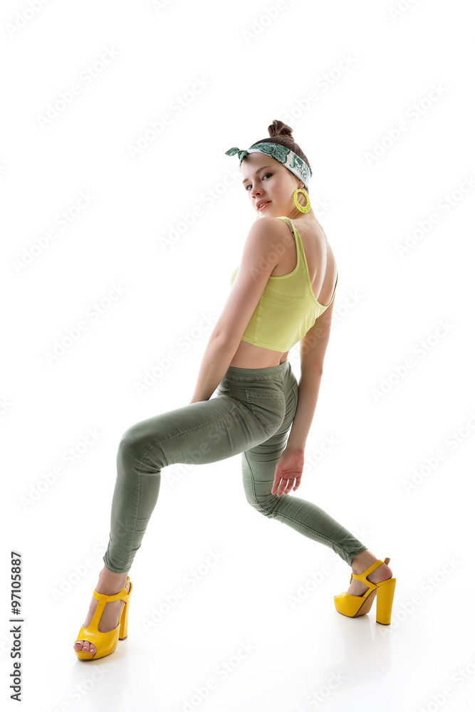Attractive slim teen girl posing in studio. Full length portrait Attractive slim teen girl posing in studio. Full length portrait