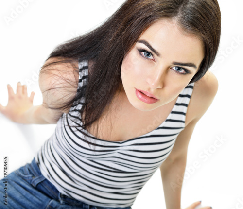 Beautiful woman staring straight at camera, over white backgroun