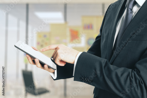 Businessman using digital tablet