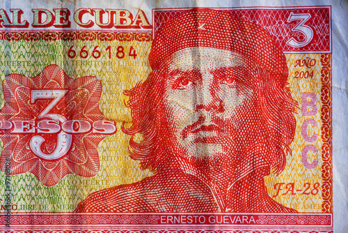 Portrait of Ernesto Che Guevara, historical leader of Cuba on three peso banknotes. photo
