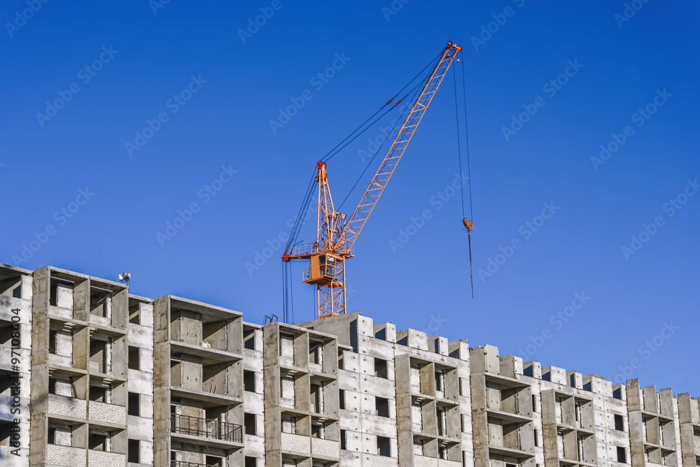 Construction of multistorey building and construction cranes Construction of multistorey building and construction cranes