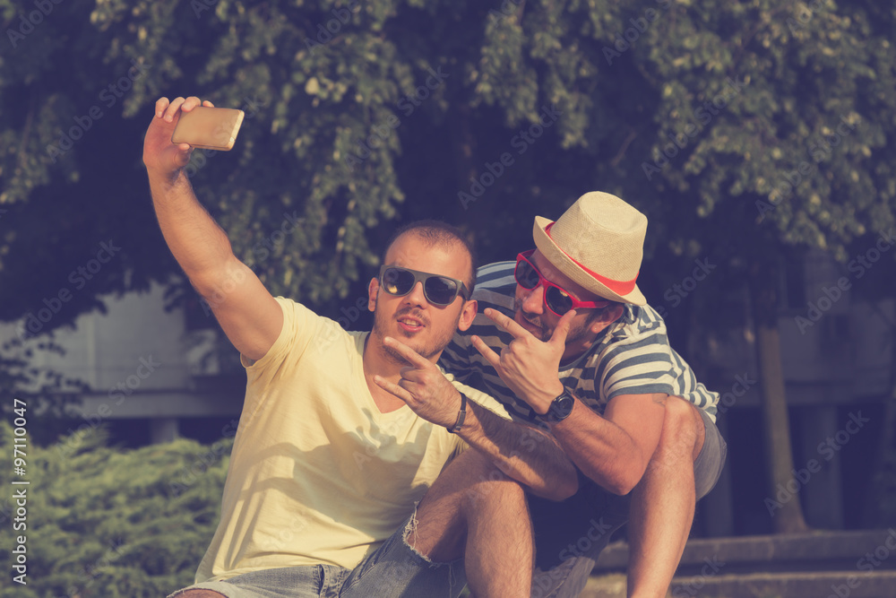 Couple of guys doing a selfie.
