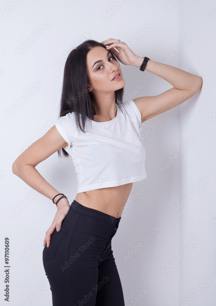 front view of pretty young woman, standing on white background front view of pretty young woman, standing on white background