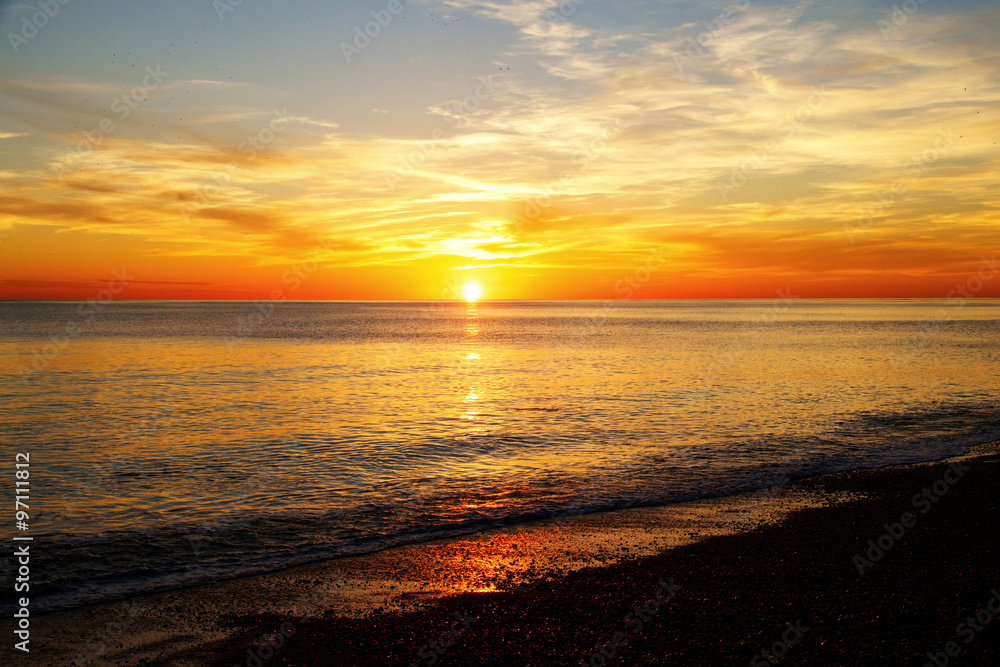 Sun rising over the sea Brighton, England, UK,