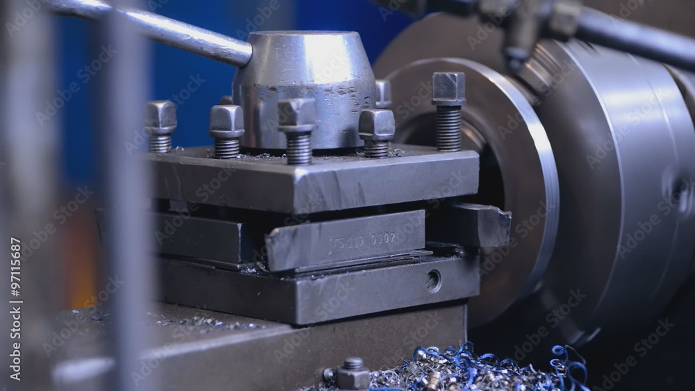 mechanics working on the milling machine hand checks item on milling machine, creating a swarf mechanics working on the milling machine hand checks item on milling machine, creating a swarf