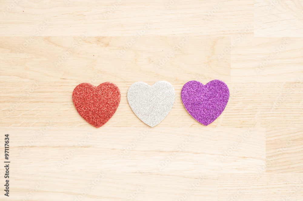 Thre hearts on wooden background Thre hearts on wooden background