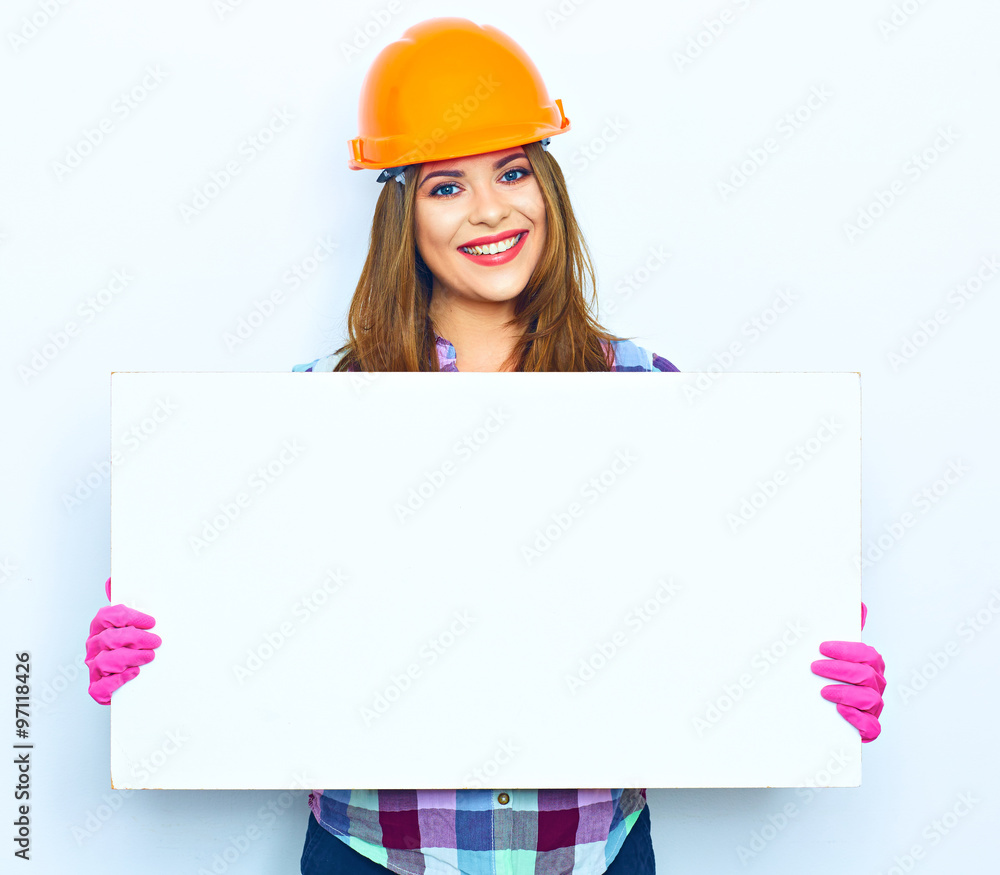 Smiling woman worker builder hold big sign board Smiling woman worker builder hold big sign board