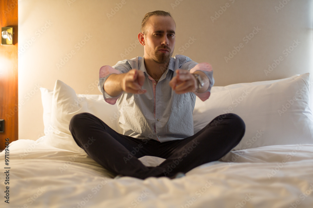 Fototapeta premium Man on the bed