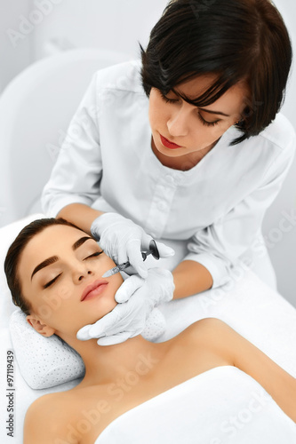 Plastic Surgery. Beautiful Young Woman Gets Cosmetic Dermal Filler Injection In Face In Beauty Salon. Reduction Of Wrinkles Treatment. Cosmetology. Beauty Face. Contouring Procedure. Mesotherapy