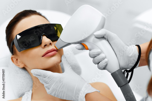 Face Care. Facial Laser Hair Removal. Beautician Giving Laser Epilation Treatment To Young Woman's Face At Beauty Clinic. Body Care. Hairless Smooth And Soft Skin. Health And Beauty Concept.