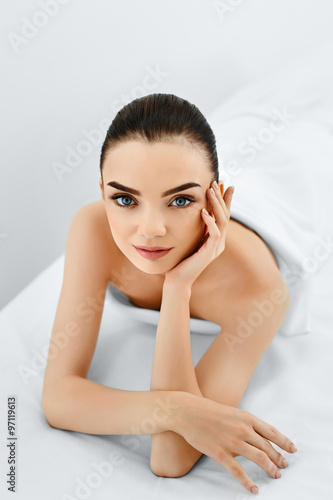 Beauty Face. Portrait Of Beautiful Smiling Model Woman Enjoying Her Perfect Fresh Clean Skin After Spa Treatment. Body And Skin Care, Cleansing And Moisturizing Concept. Healthy Lifestyle